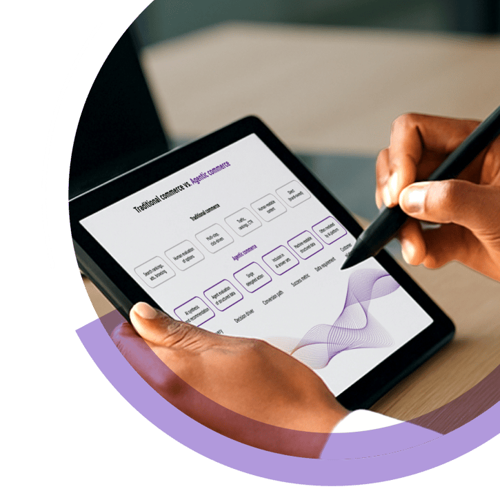 A person uses a stylus on a tablet to review a visual comparison of traditional commerce versus agentic commerce in a modern workspace.